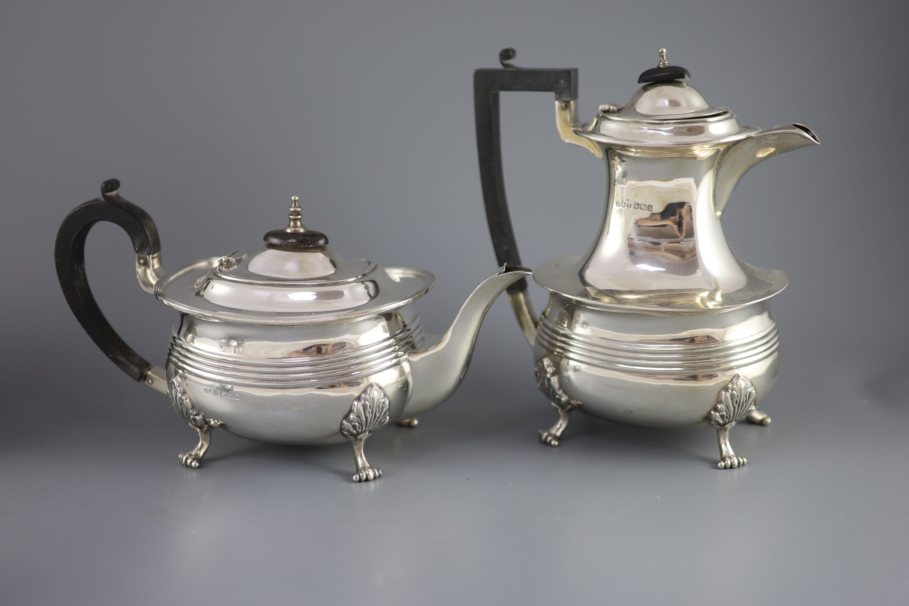 A matched silver five-piece tea service of reeded oval form, Jenkins & Timm, Sheffield 1922-3 and 1925